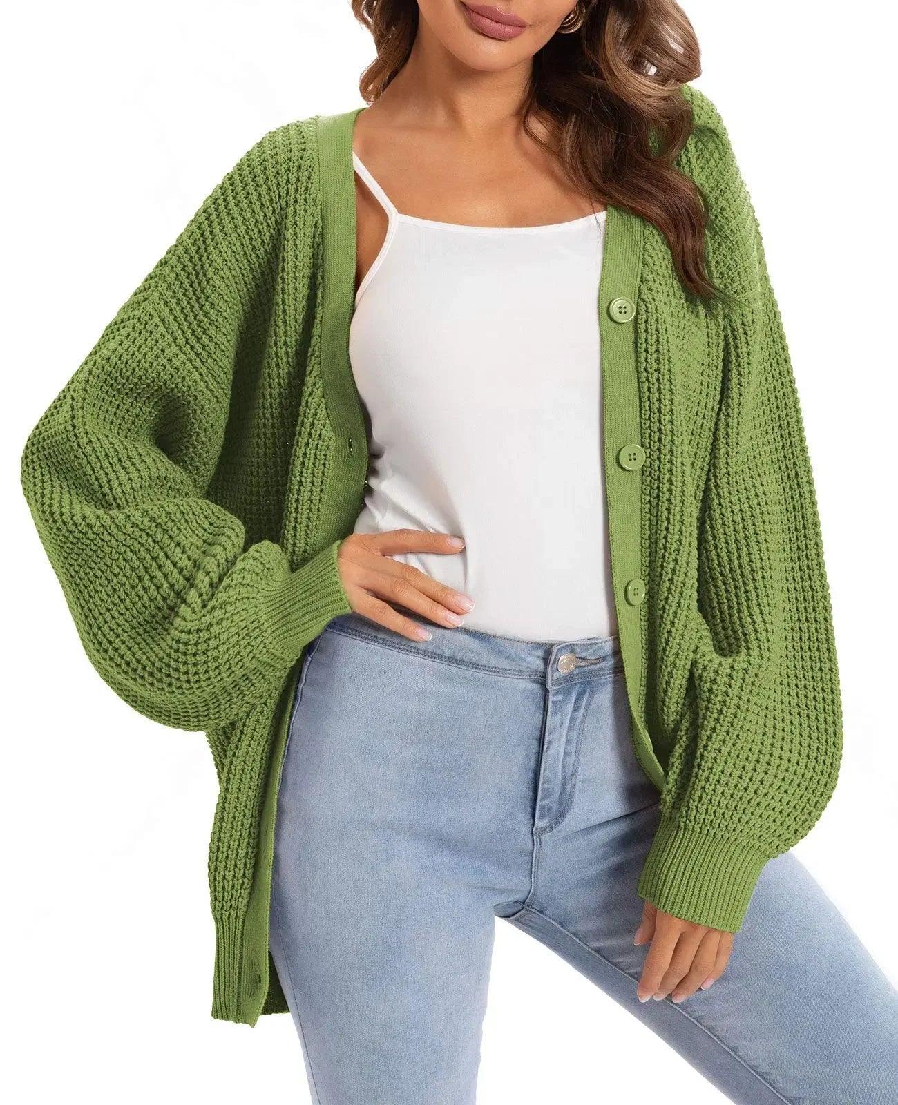 Green knitted cardigan with buttons, styled over white top and jeans for women's fashion