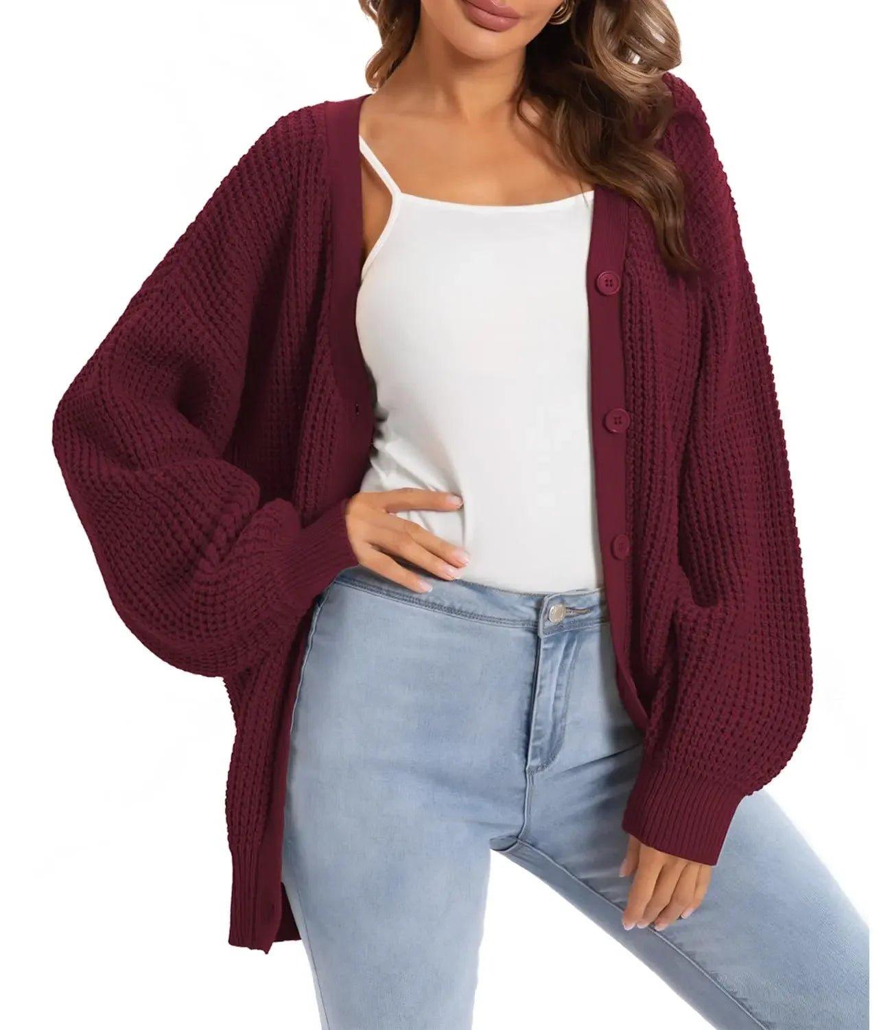 Burgundy knit cardigan with buttons, worn over white top and light jeans, women's fashion