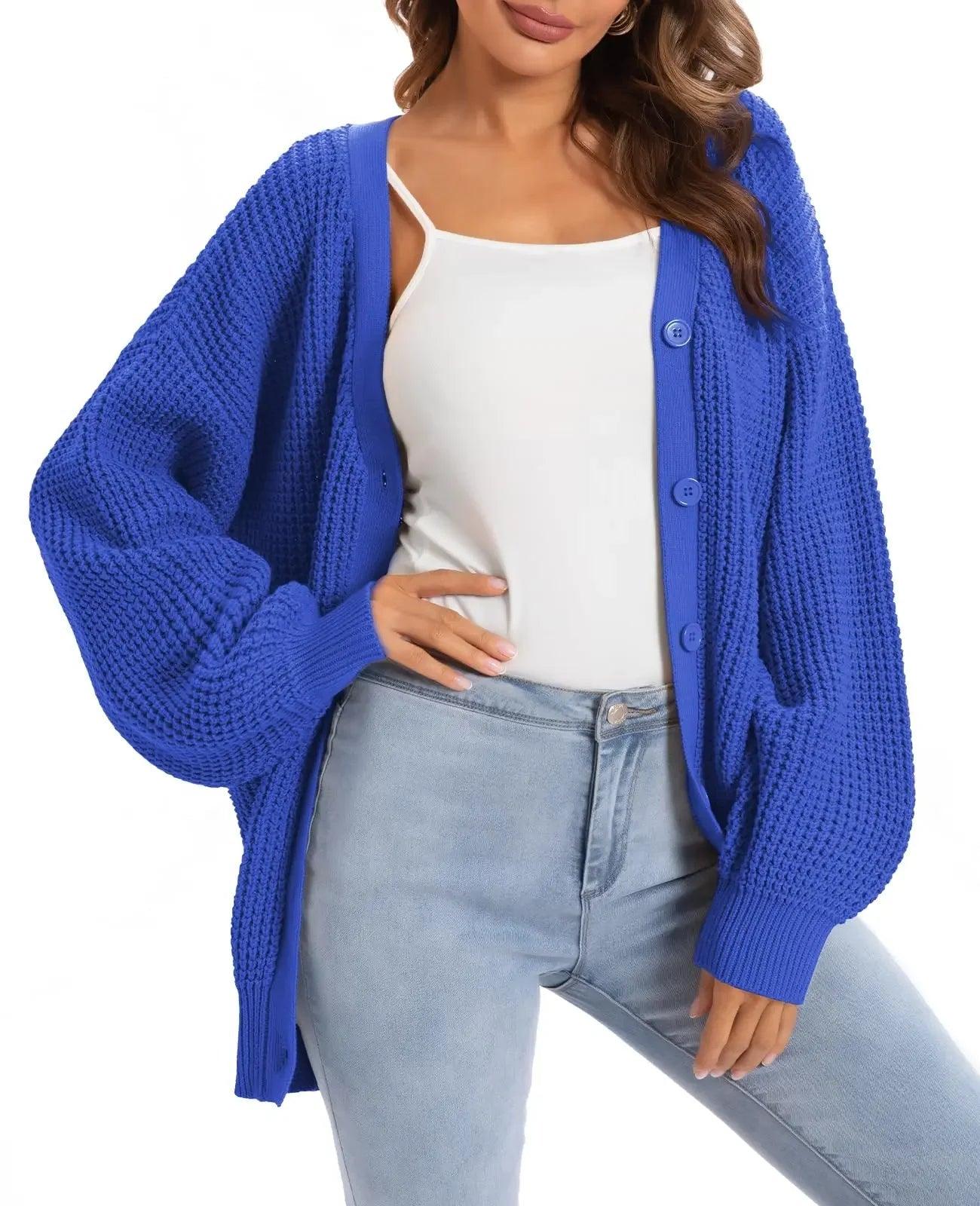 Blue knit cardigan sweater for women, cozy oversized fit with buttons, styled with white top and jeans