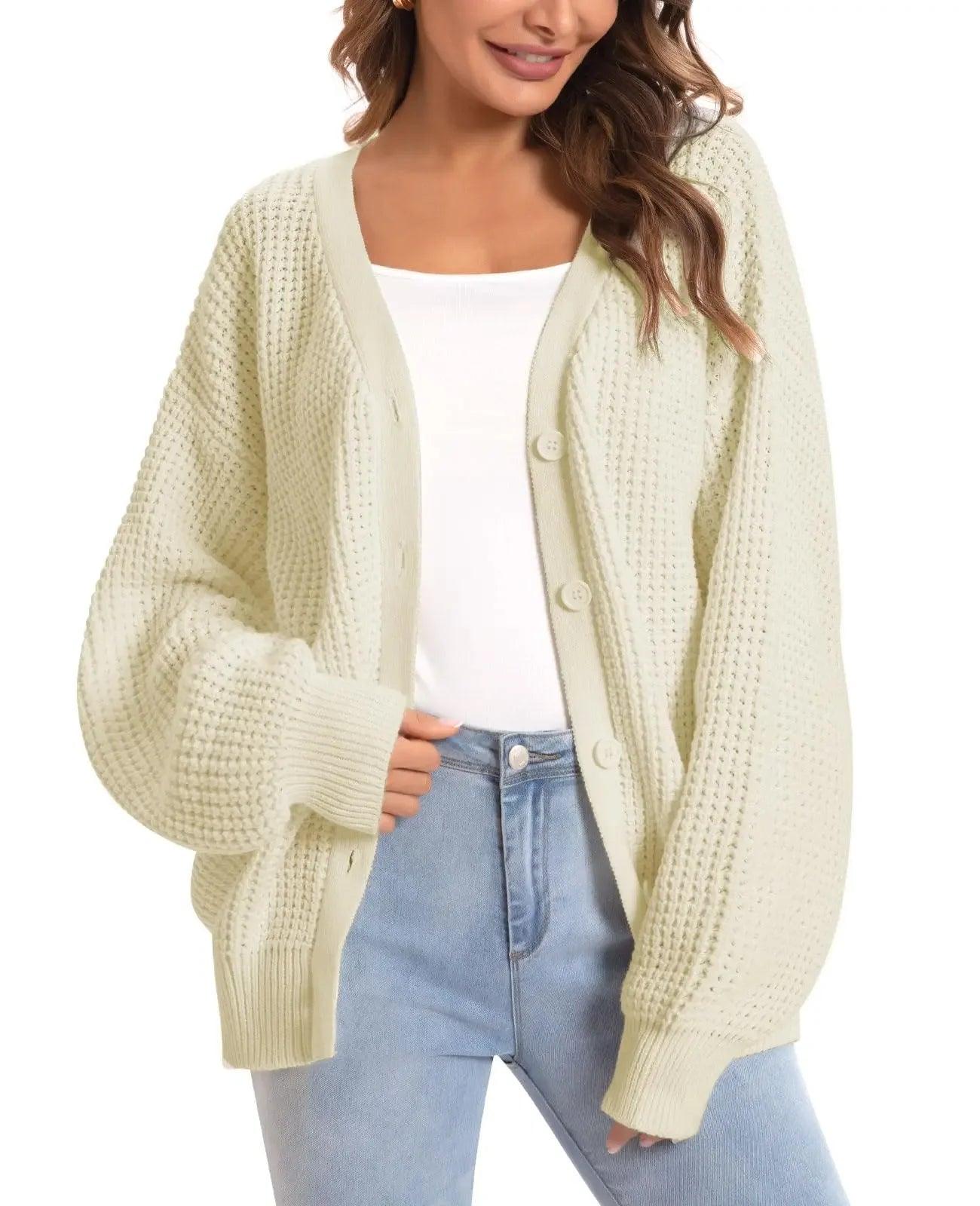 Cream waffle knit cardigan with buttons, worn over white top and blue jeans, women's fashion