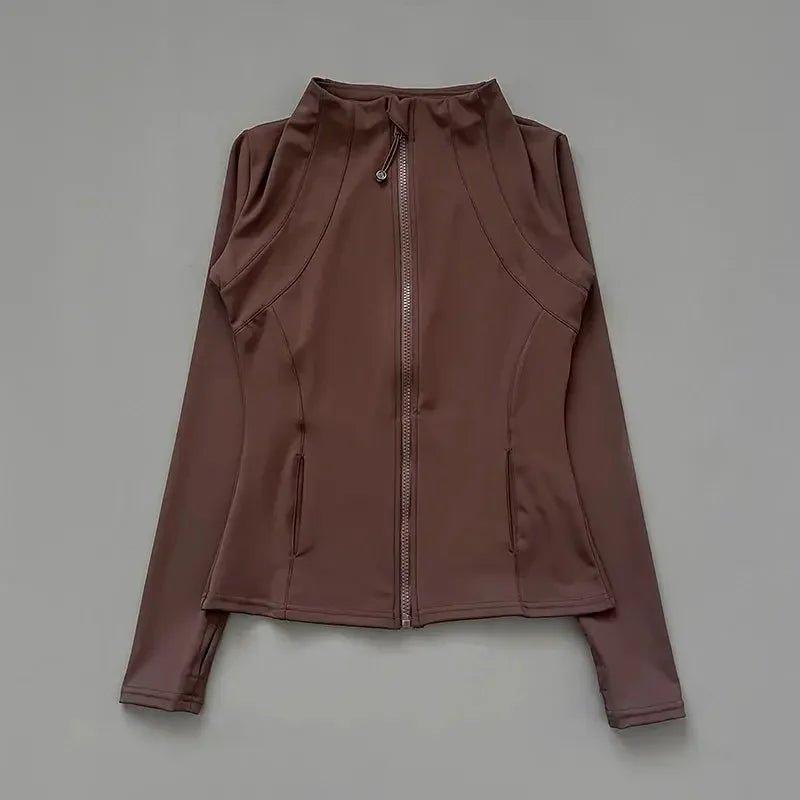 Brown women's zip-up athletic jacket with long sleeves and side pockets, stylish fitness wear
