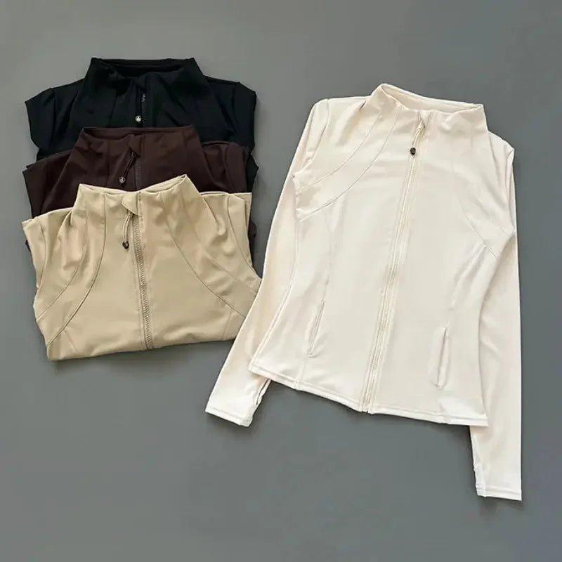 Women's long sleeve zip-up athletic jackets in black, brown, beige, and white for fitness and casual wear