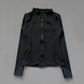 Black women's zip-up fitness jacket with high neck and long sleeves, stylish activewear for gym or casual wear