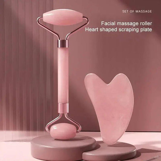 Pink facial massage roller and heart-shaped scraping plate for skincare routine
