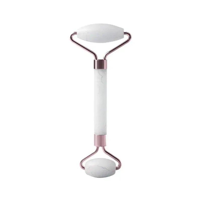 White marble facial roller with rose gold handles for skincare and beauty routines