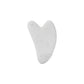 White heart-shaped gua sha tool for facial massage and skincare routine