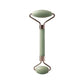 Green jade facial roller for skincare and relaxation, dual-ended beauty tool