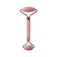 Pink dual-sided facial roller for skincare and beauty routines