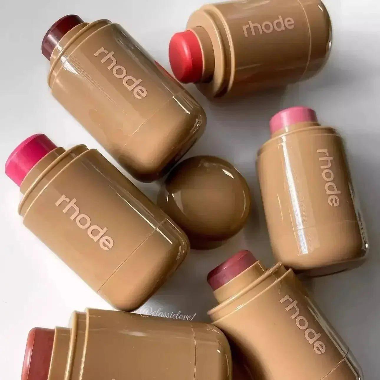 Rhode lip balms in assorted shades, glossy tan tubes with colorful caps, beauty essentials for women's fashion