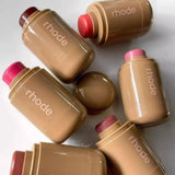 Rhode lip balms in assorted shades, glossy tan tubes with colorful caps, beauty essentials for women's fashion
