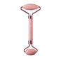 Pink rose quartz facial roller for skincare and beauty routines