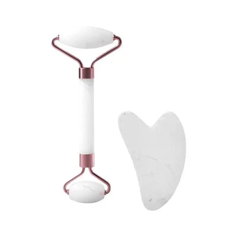 White marble facial roller and gua sha tool with rose gold accents for skincare routine
