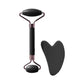Black facial roller and gua sha tool for skincare and beauty routines
