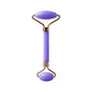 Purple facial roller with gold accents for skincare and beauty routines
