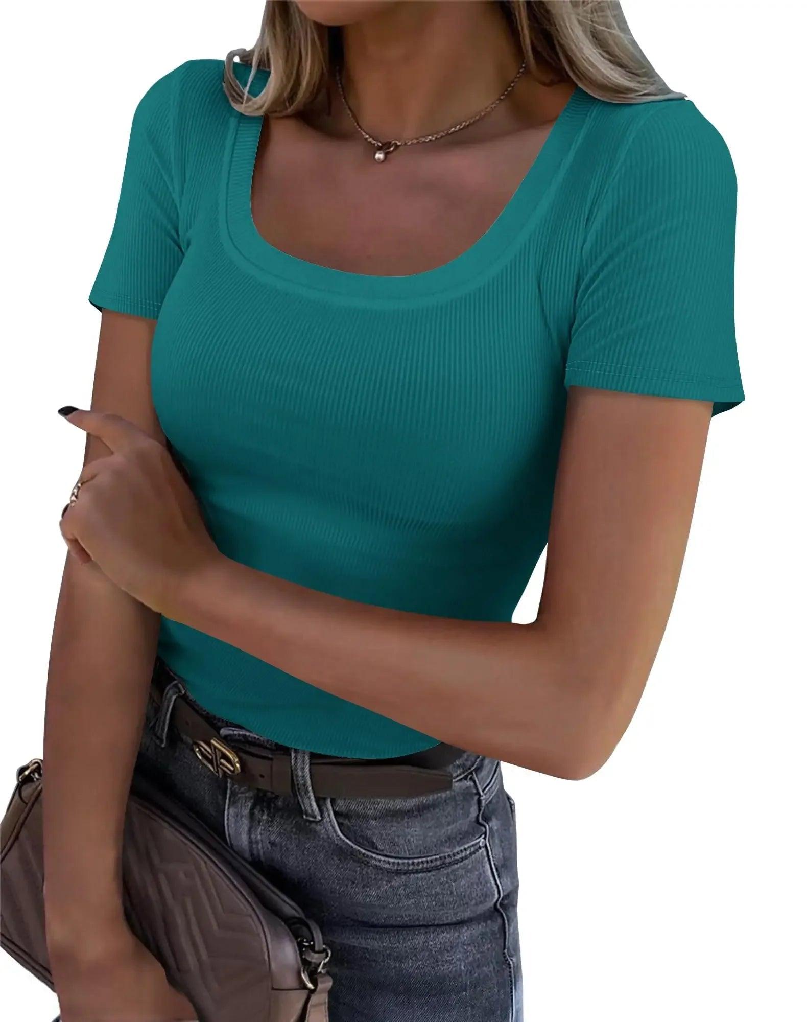 Teal ribbed women's scoop neck t-shirt with short sleeves, paired with jeans and a belt, stylish casual fashion top