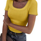 Yellow ribbed women's crop top with square neckline, paired with jeans and belt for casual fashion
