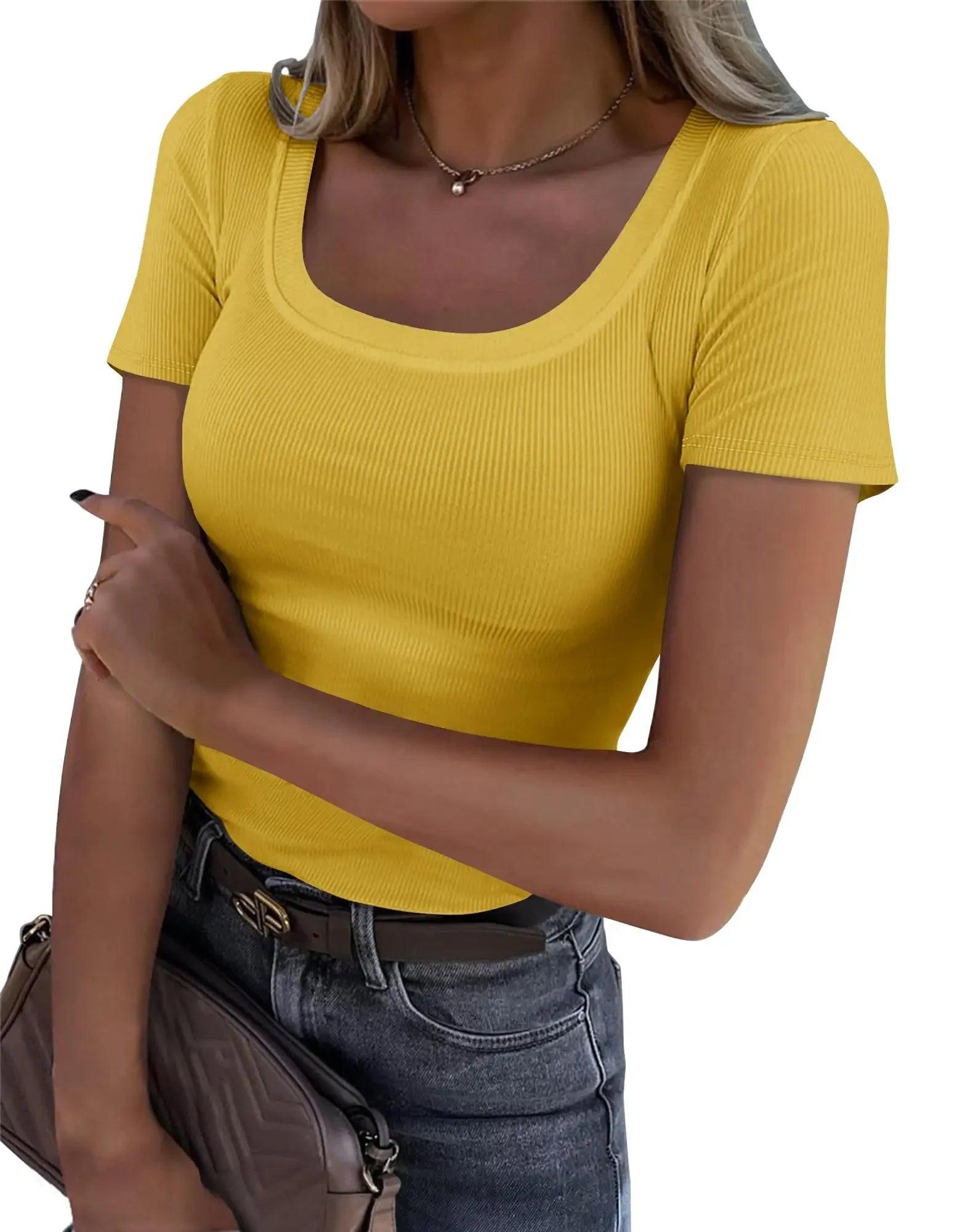 Yellow ribbed women's crop top with square neckline, paired with jeans and belt for casual fashion