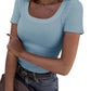 Light blue ribbed women's scoop neck t-shirt with short sleeves, paired with jeans and a belt