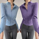 Women's zip-up athletic jackets in blue and purple, paired with gray leggings for workout or casual wear.