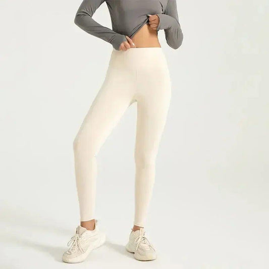 Cream high-waist leggings with gray long-sleeve top and white sneakers, women's fashion activewear