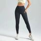 Black high-waisted leggings with cream crop top and white sneakers, women's fashion activewear