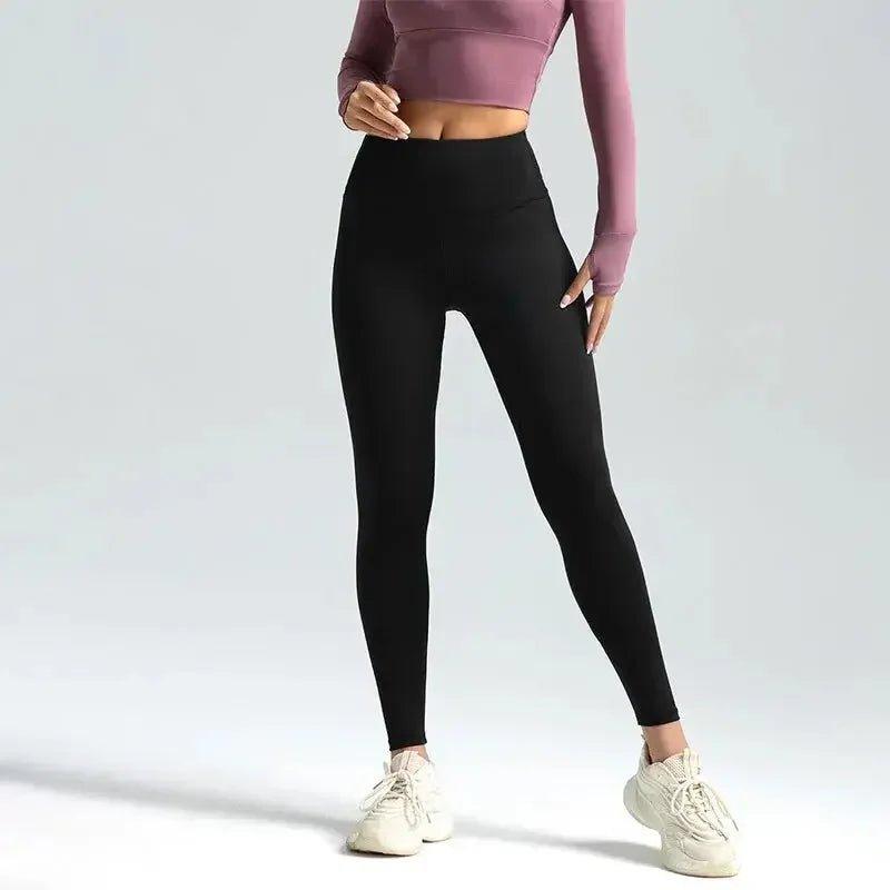 Black high-waist leggings with pink crop top, women's fashion activewear