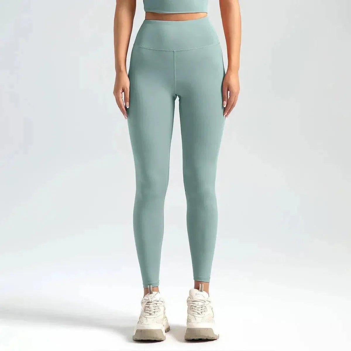 Mint green high-waisted leggings with matching crop top, ideal for women's fashion and fitness wear