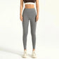 Grey high-waisted leggings for women, paired with sports bra and sneakers, ideal for fitness and casual wear.