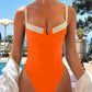 Orange one-piece swimsuit with white straps, poolside fashion for women