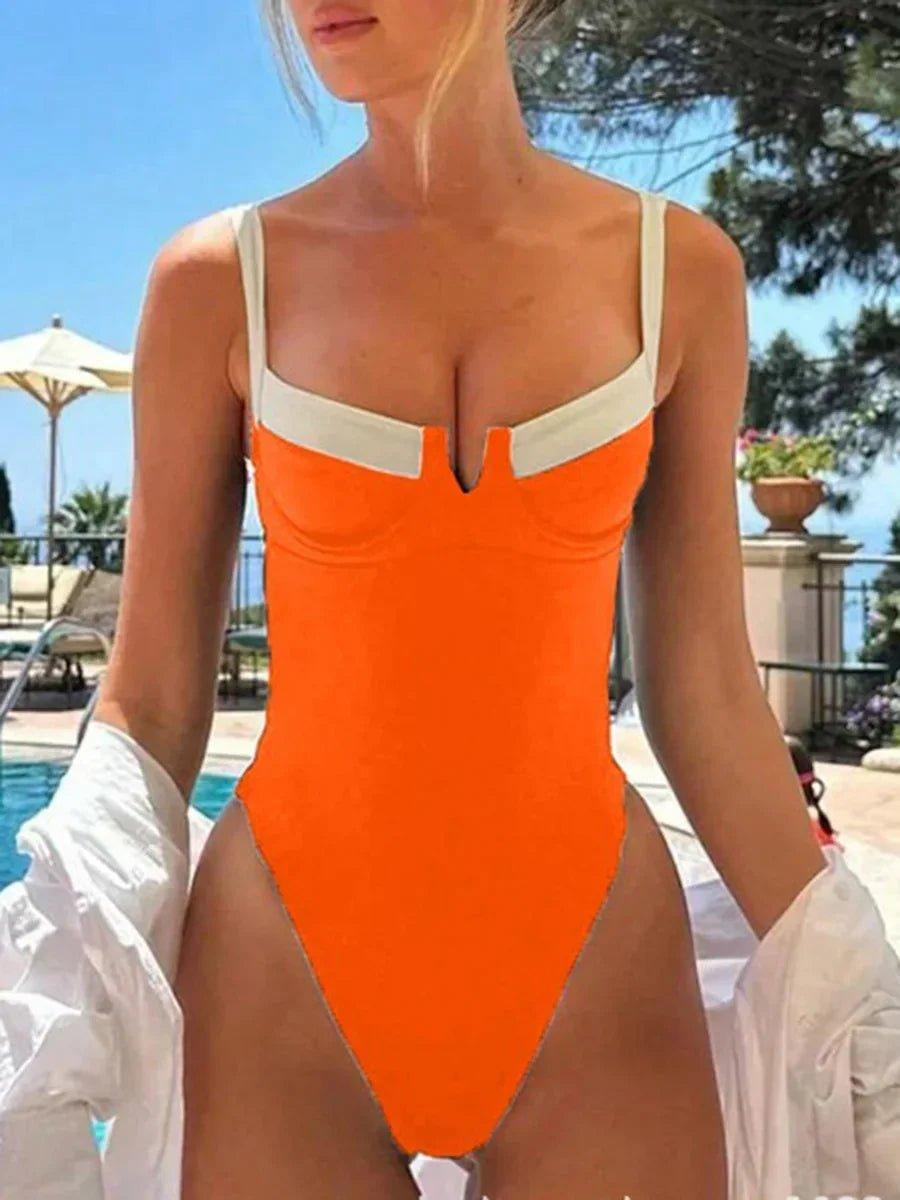 Orange one-piece swimsuit with white straps, poolside fashion for women