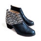 Black women's ankle boots with geometric patterned fabric detail and low block heel