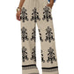 Boho print wide-leg women's pants with drawstring waist, floral pattern, and tassel hem detail