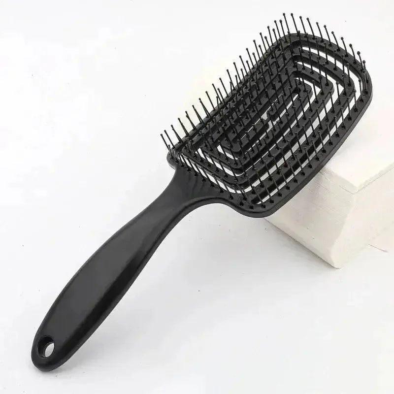 Black detangling hair brush with ergonomic handle for smooth styling