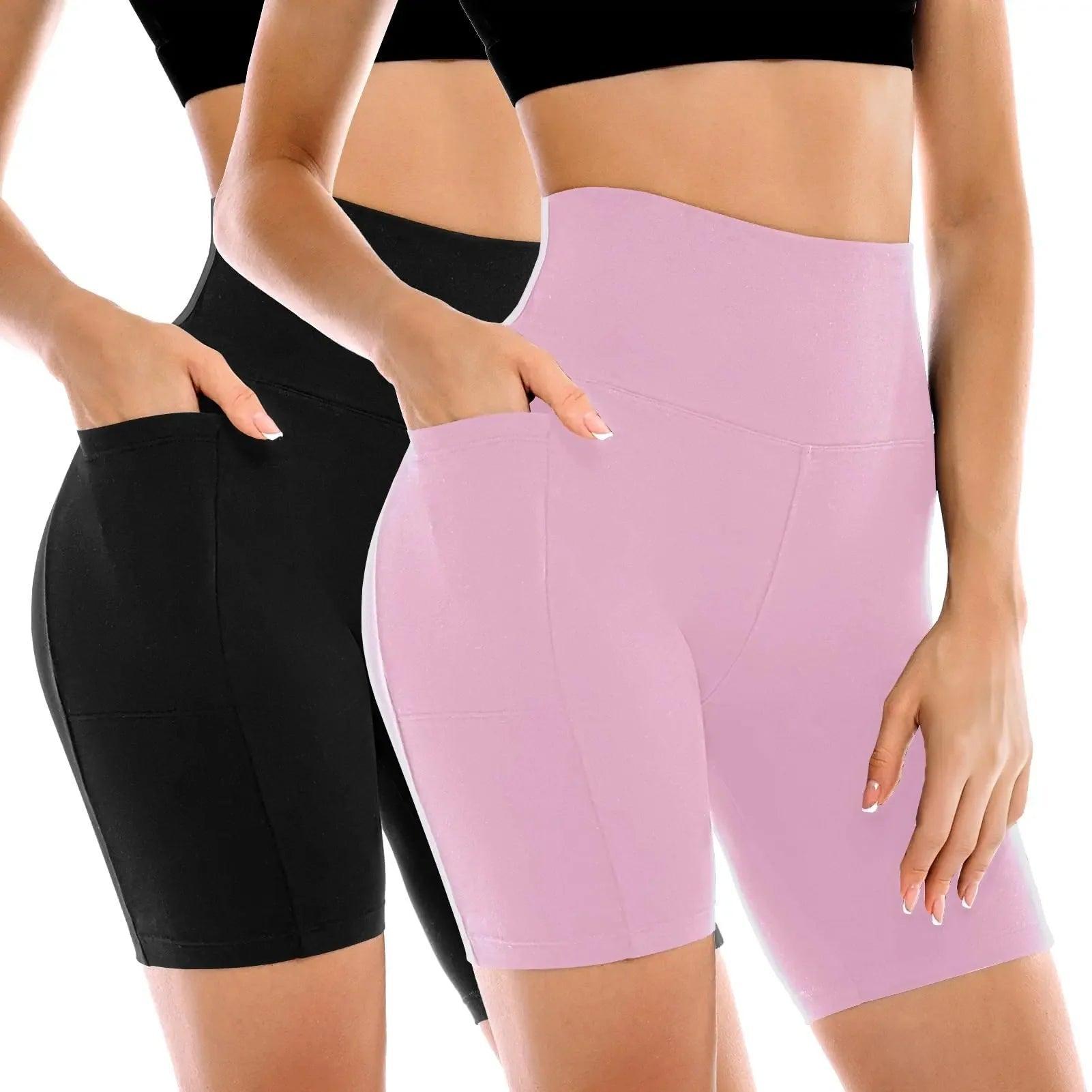 Women's high-waisted biker shorts in black and pink, featuring side pockets and seamless design for fitness or casual wear