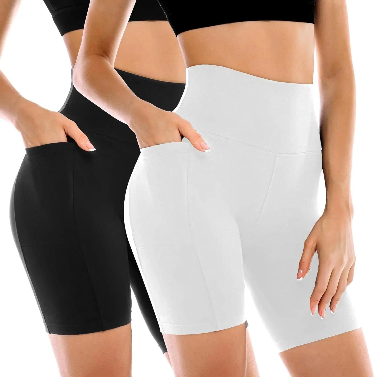 Women's high-waisted biker shorts in black and white, featuring pockets and seamless design for comfort and style.