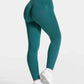 Teal high-waisted leggings with white trim, styled with white sneakers for women's fashion and fitness