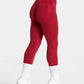 Red high-waisted leggings with white trim, paired with white sneakers and socks, ideal for women's fashion and fitness.