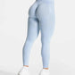 Light blue high-waisted leggings with sculpting design, paired with white sneakers for women's fashion