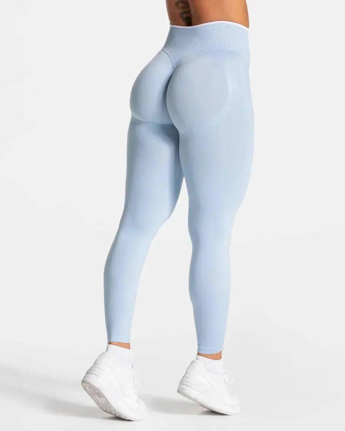 Light blue high-waisted leggings with sculpting design, paired with white sneakers for women's fashion