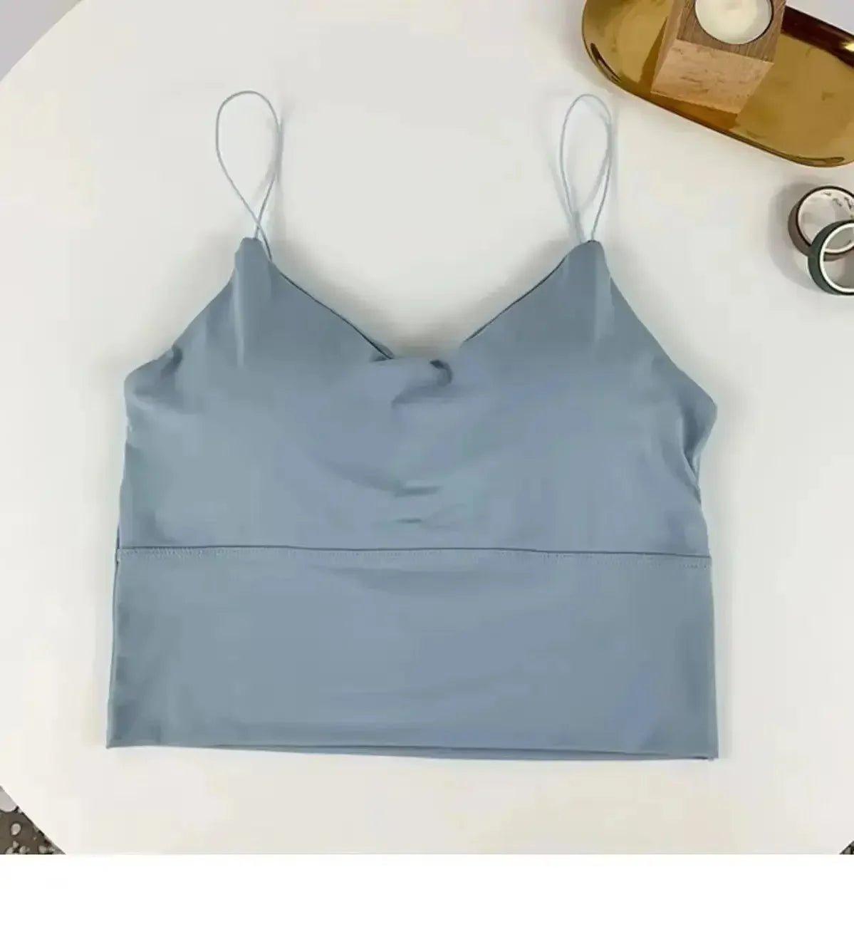 Light blue women's crop top with thin straps, stylish fashion wear for casual or layering looks