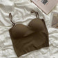 Olive green women's strapless bralette on white fabric, fashion lingerie
