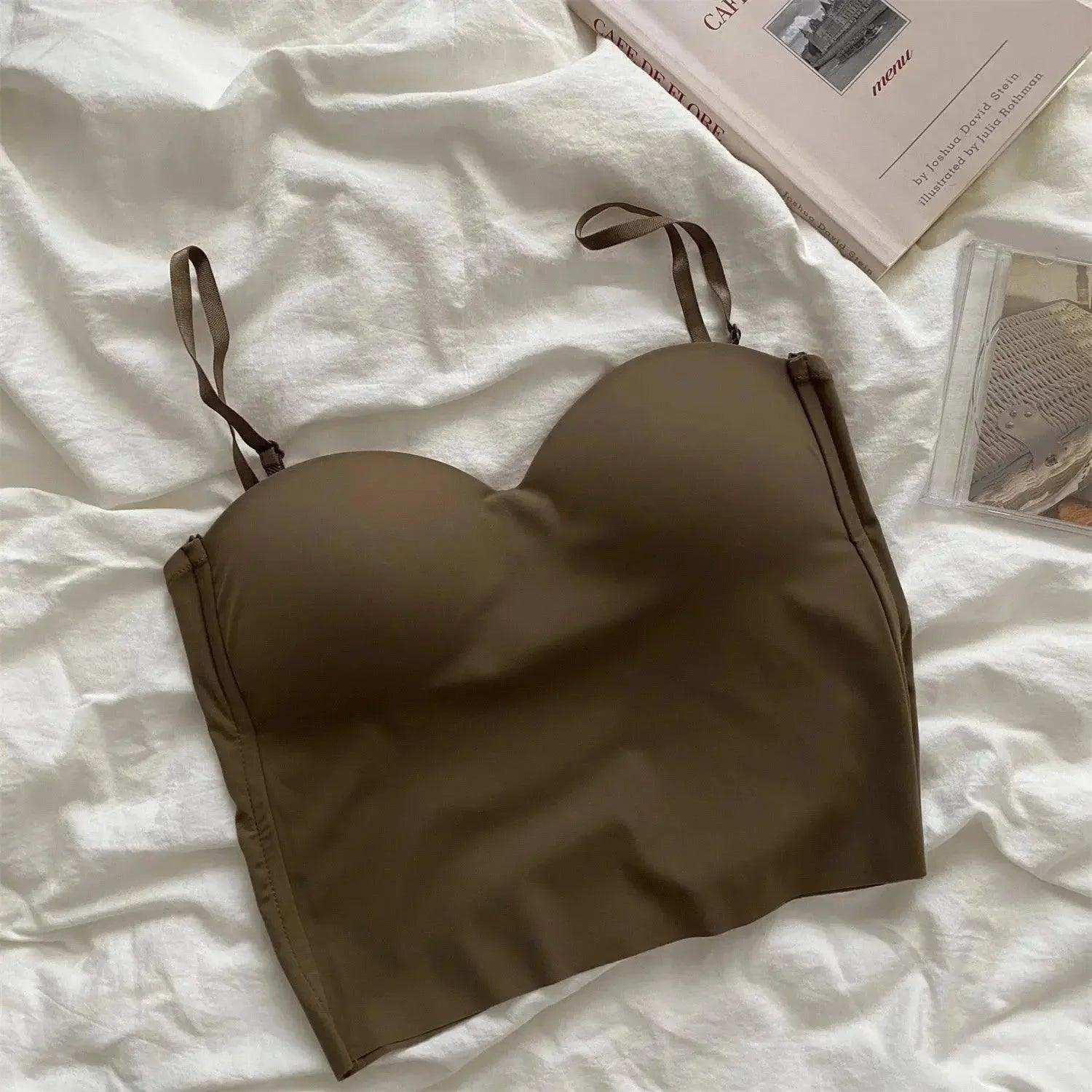 Olive green women's strapless bralette on white fabric, fashion lingerie
