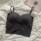 Black strapless bralette on white linen with cafe menu book, women's fashion lingerie