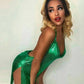 Woman in shimmering green sequin dress with high slit, perfect for fashion events and nightouts