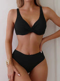 Black ribbed bikini set with twist front top and high-waisted bottoms, women's swimwear fashion