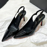 Black patent leather pointed-toe slingback heels with red soles, elegant women's fashion footwear