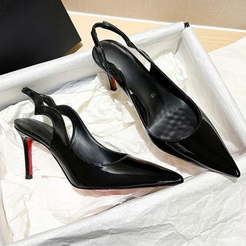 Black patent leather stiletto heels with red soles, pointed toe slingback design for women's fashion