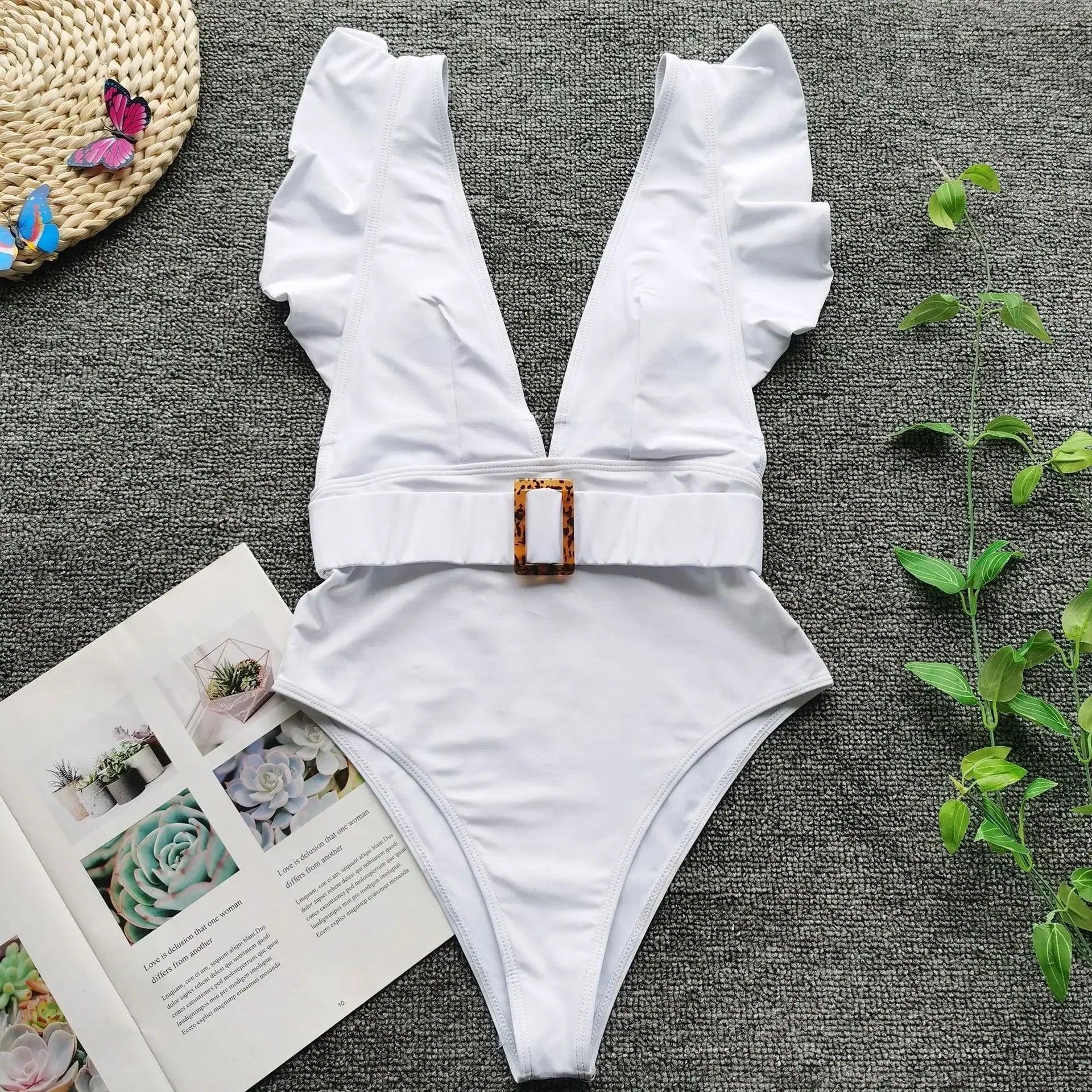 White ruffle one-piece swimsuit with tortoiseshell buckle, beach fashion for women