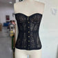 Black lace corset top with gold buttons, women's fashion lingerie, strapless bustier style