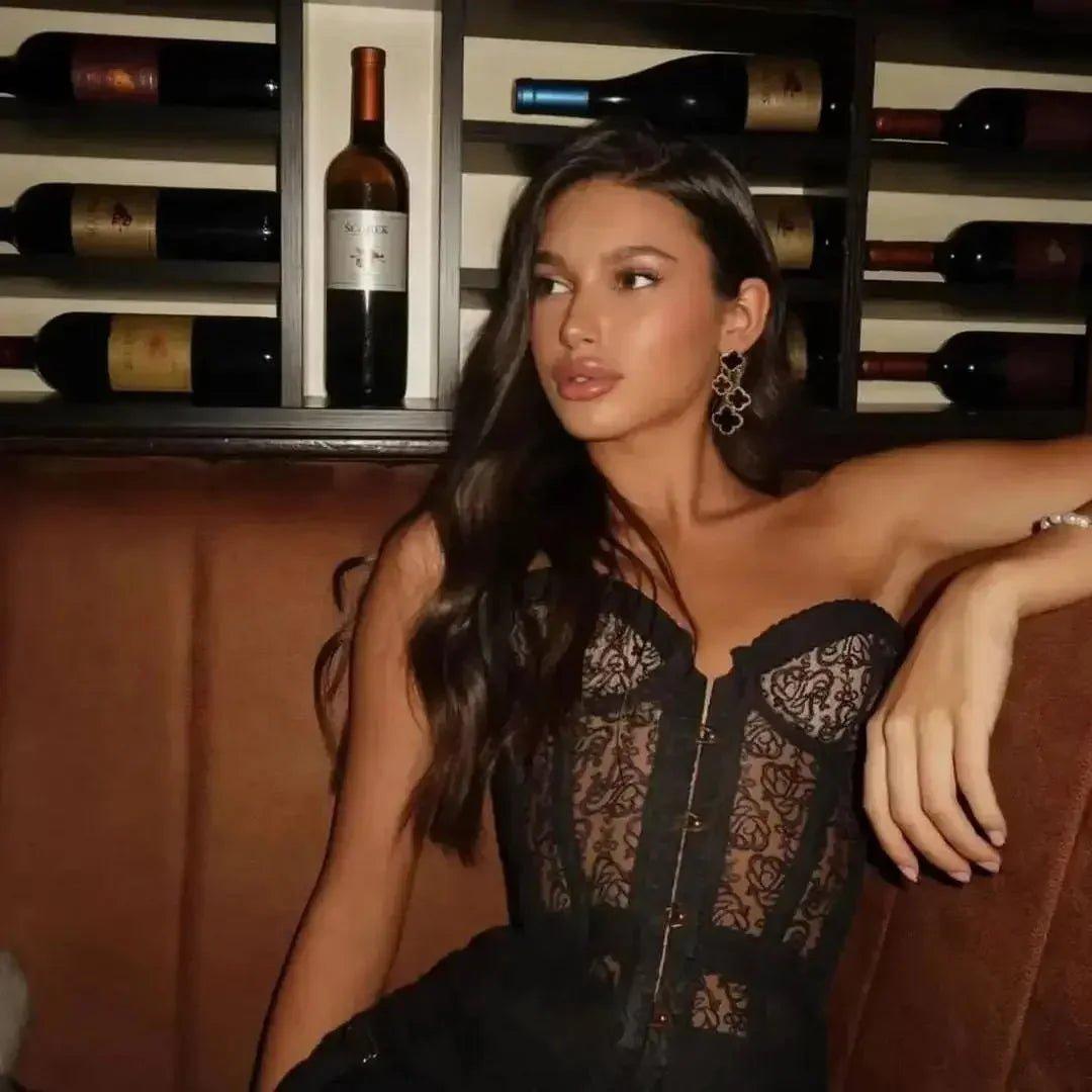 Woman in black lace corset top, elegant evening wear, wine cellar backdrop, fashion style